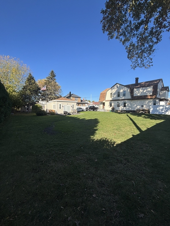a view of a swimming pool with an outdoor space and seating area