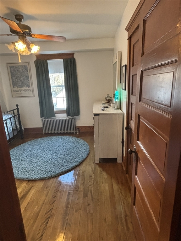 460 Burncoat Street, Unit B Worcester, MA 01606 - Photo 13 of 19 a room with window and hardwood