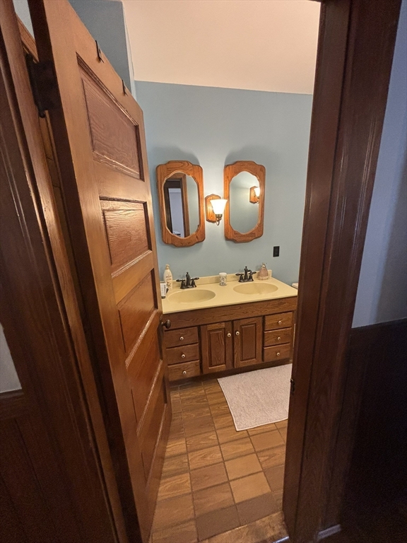 460 Burncoat Street, Unit B Worcester, MA 01606 - Photo 19 of 19 a bathroom with a sink and a mirror