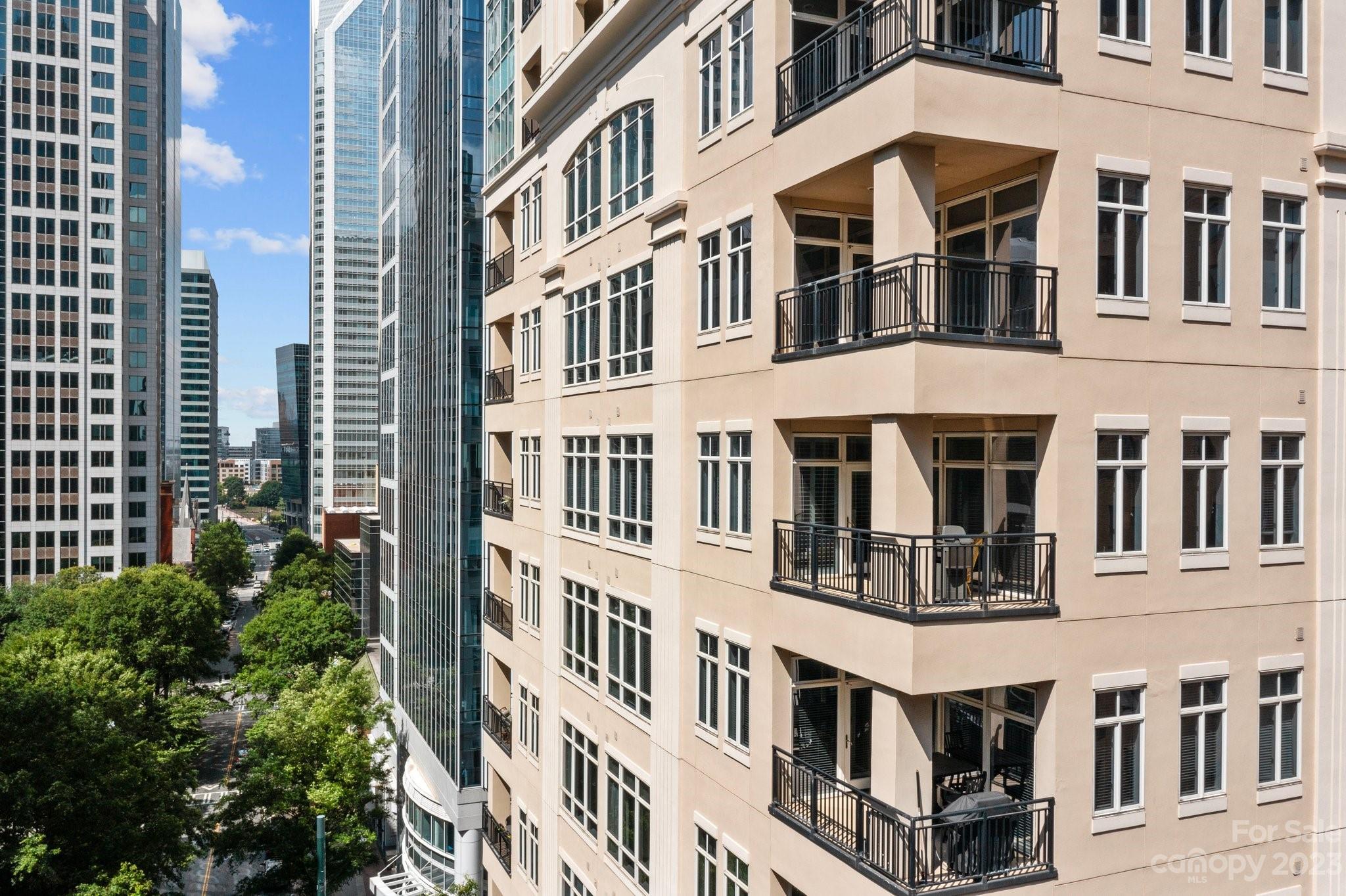 230 South Tryon Street, Unit 906 Charlotte, NC 28202 - Photo 1 of 27 a large building with a lot of windows