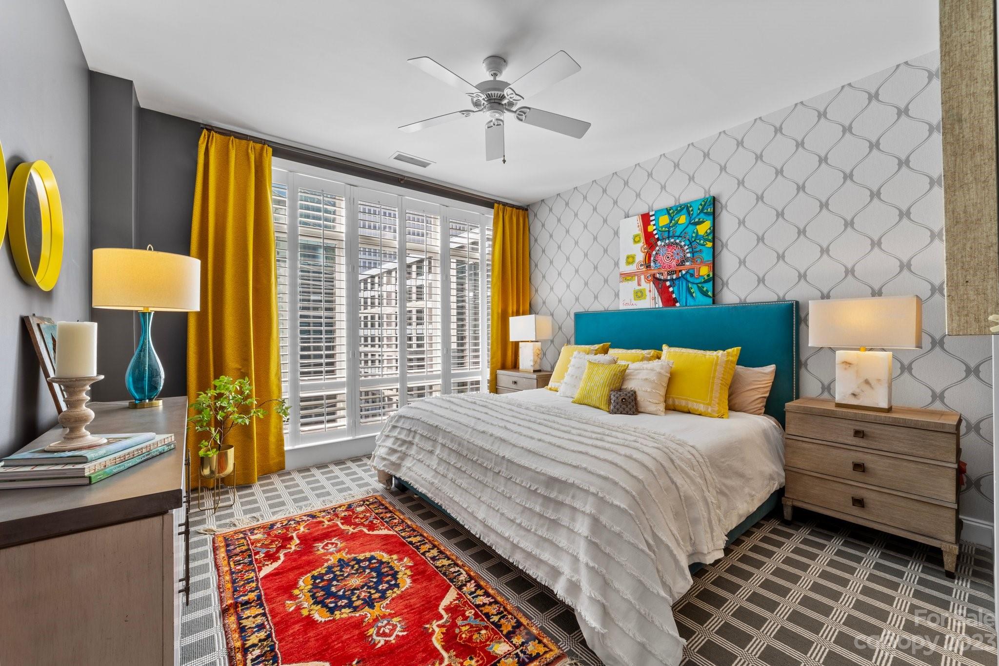 230 South Tryon Street, Unit 906 Charlotte, NC 28202 - Photo 14 of 27 a bedroom with a bed and a window