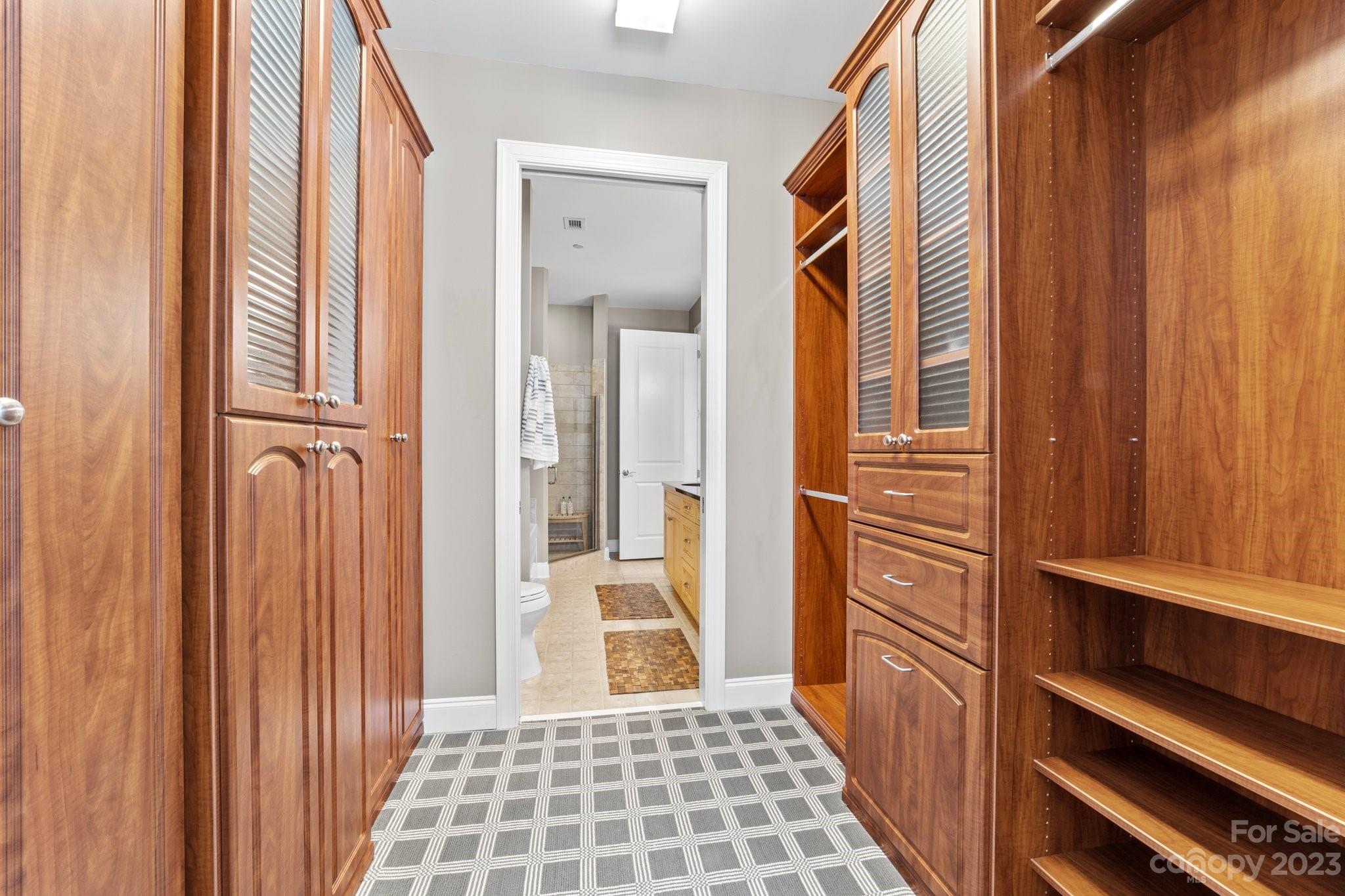 230 South Tryon Street, Unit 906 Charlotte, NC 28202 - Photo 15 of 27 a view of a hallway with wooden floor and door