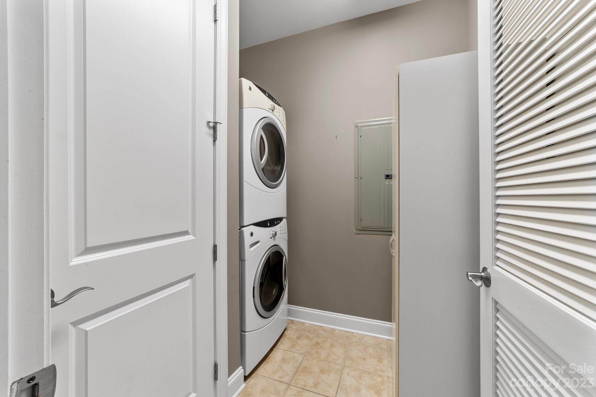 230 South Tryon Street, Unit 906 Charlotte, NC 28202 - Photo 24 of 27 a utility room with dryer and washer