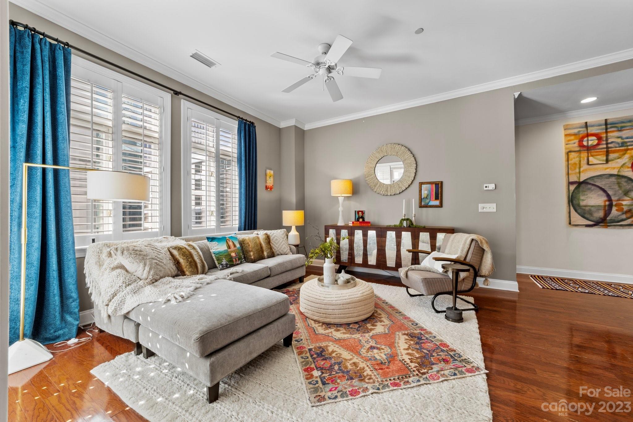 230 South Tryon Street, Unit 906 Charlotte, NC 28202 - Photo 9 of 27 a living room with furniture and a large window
