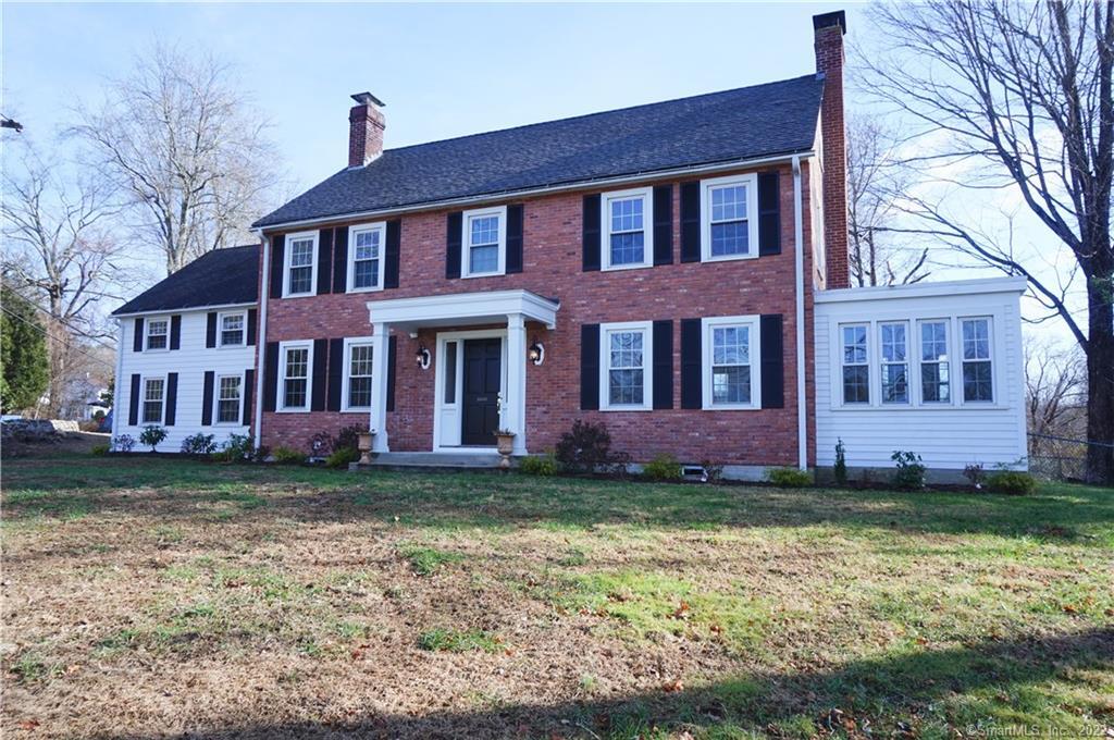 189 Harland Road Norwich, CT 06360 - Photo 1 of 1 a brick building that has a lots of windows in it