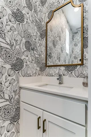 a bathroom with a sink and mirror