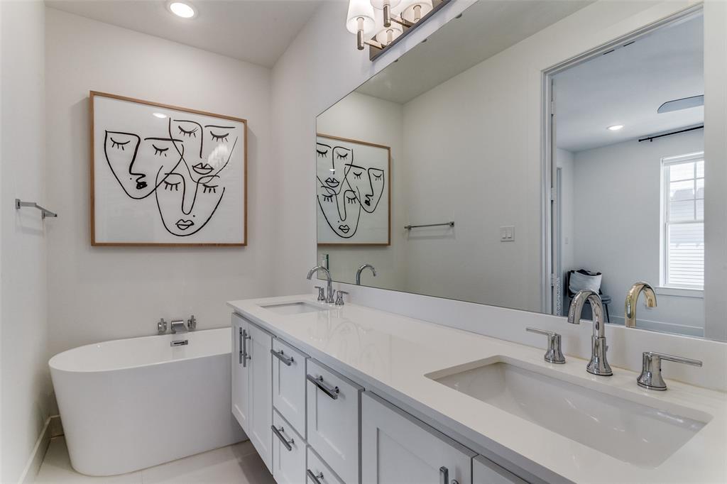 645 North Tyler Street, Unit 106 Dallas, TX 75208 - Photo 23 of 25 Bathroom featuring a tub and vanity