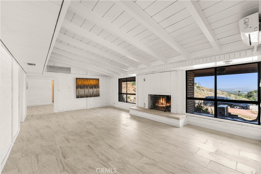 6308 Hawarden Drive Riverside, CA 92506 - Photo 7 of 37 a view of a room with window and fireplace