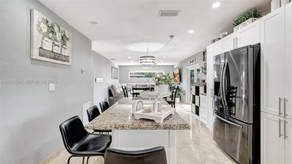 a bedroom with a bed and a ceiling fan