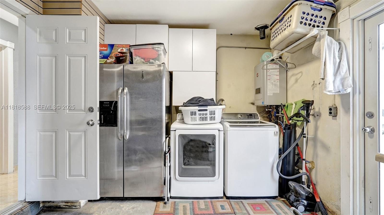 8540 Northwest 182nd Street Hialeah, FL 33015 - Photo 31 of 63 a white refrigerator freezer and a stove