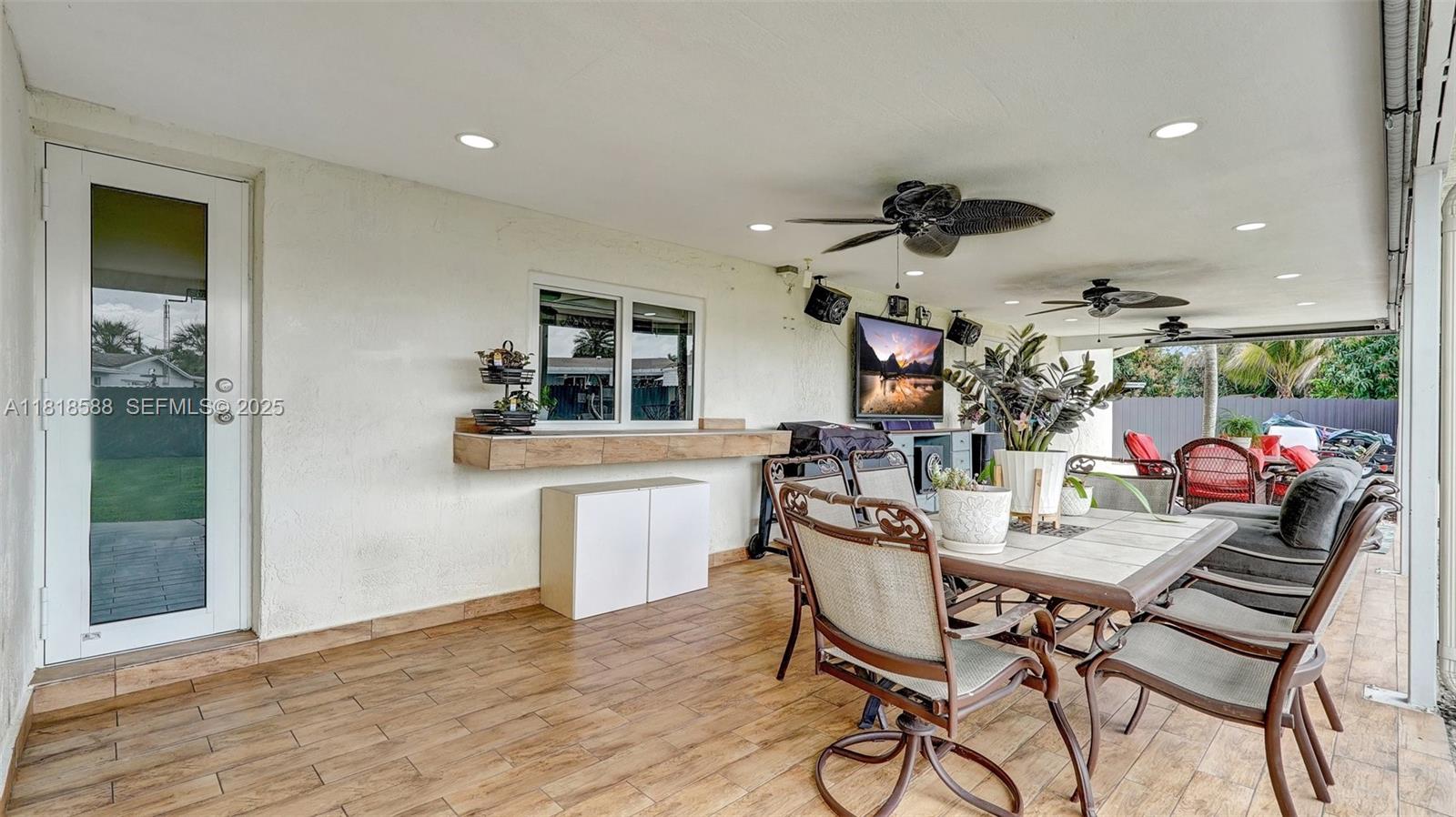 8540 Northwest 182nd Street Hialeah, FL 33015 - Photo 34 of 63 a dining room with furniture and window