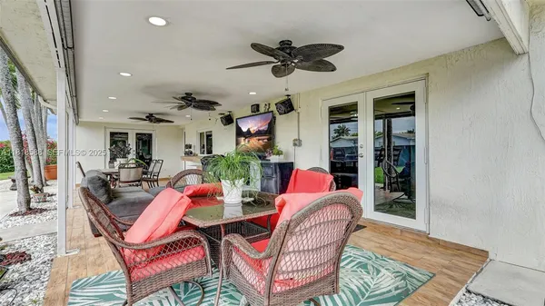 a view of a chairs and table in the patio