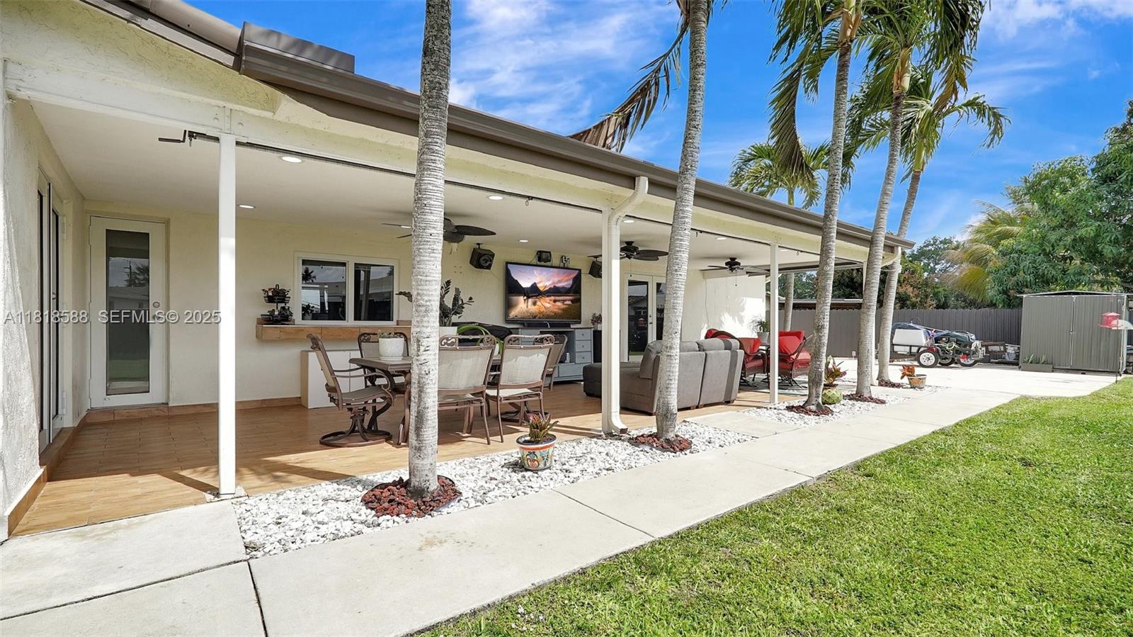 8540 Northwest 182nd Street Hialeah, FL 33015 - Photo 38 of 63 a view of a backyard with a patio