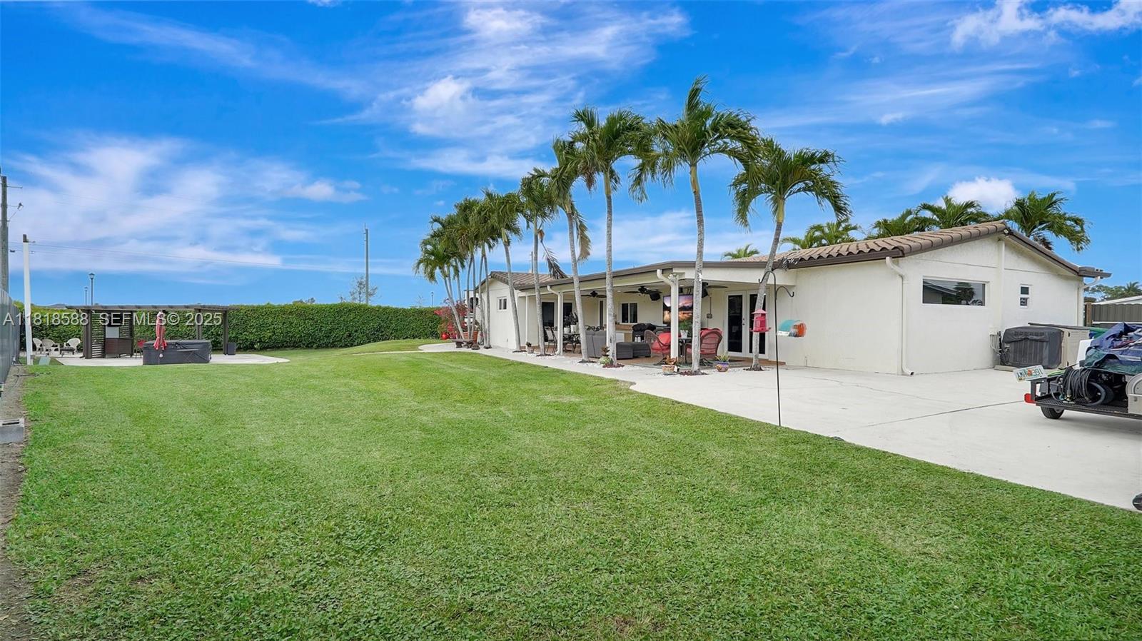 8540 Northwest 182nd Street Hialeah, FL 33015 - Photo 43 of 63 a view of a house with a backyard
