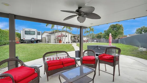 an aerial view of a chairs and table