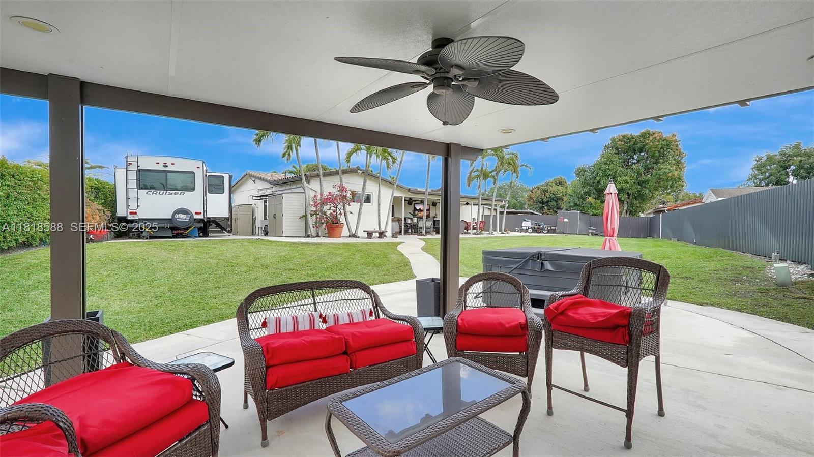 8540 Northwest 182nd Street Hialeah, FL 33015 - Photo 50 of 63 a view of a yard with a dining table and chairs
