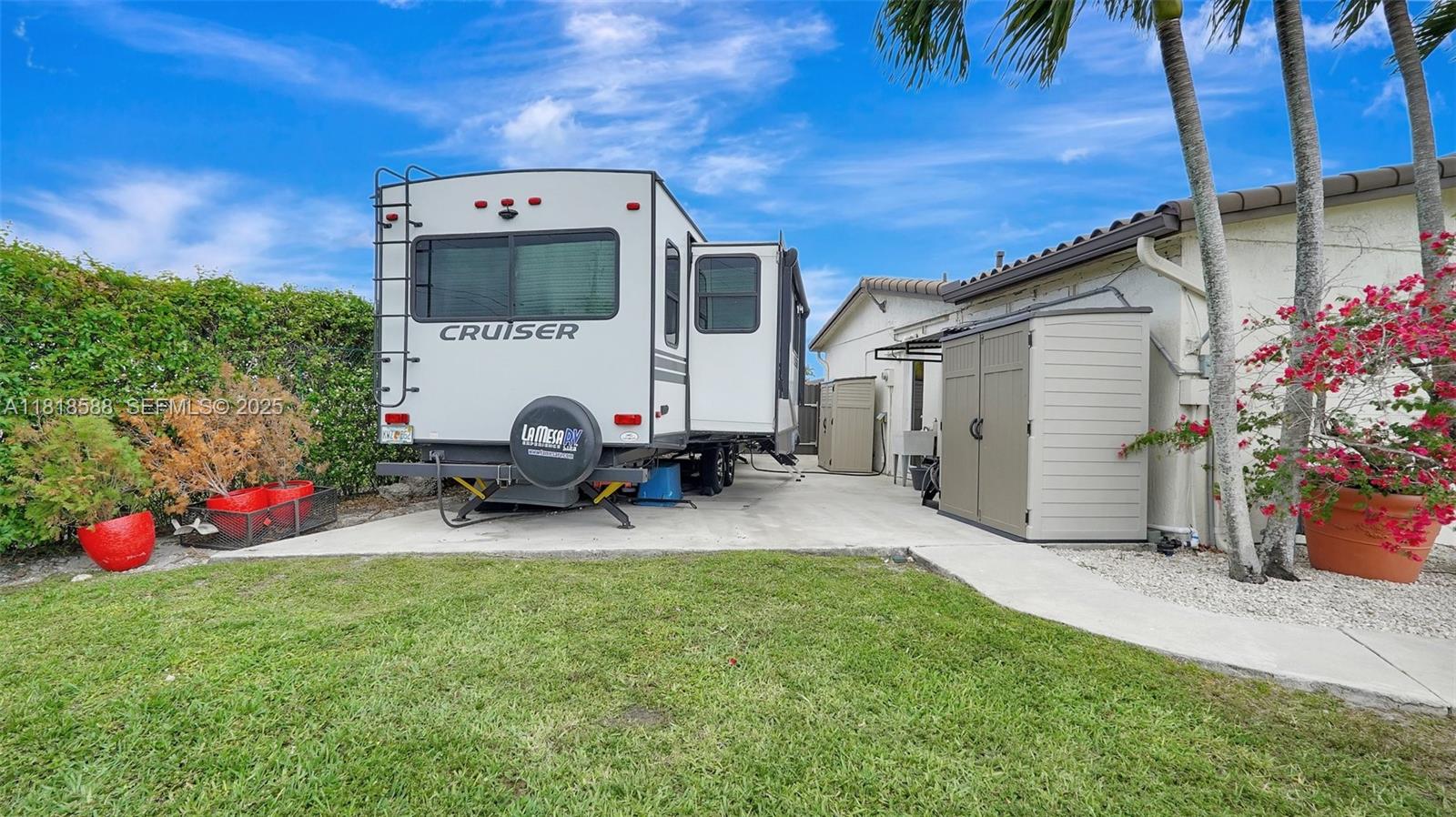 8540 Northwest 182nd Street Hialeah, FL 33015 - Photo 51 of 63 a view of a house with backyard and sitting area