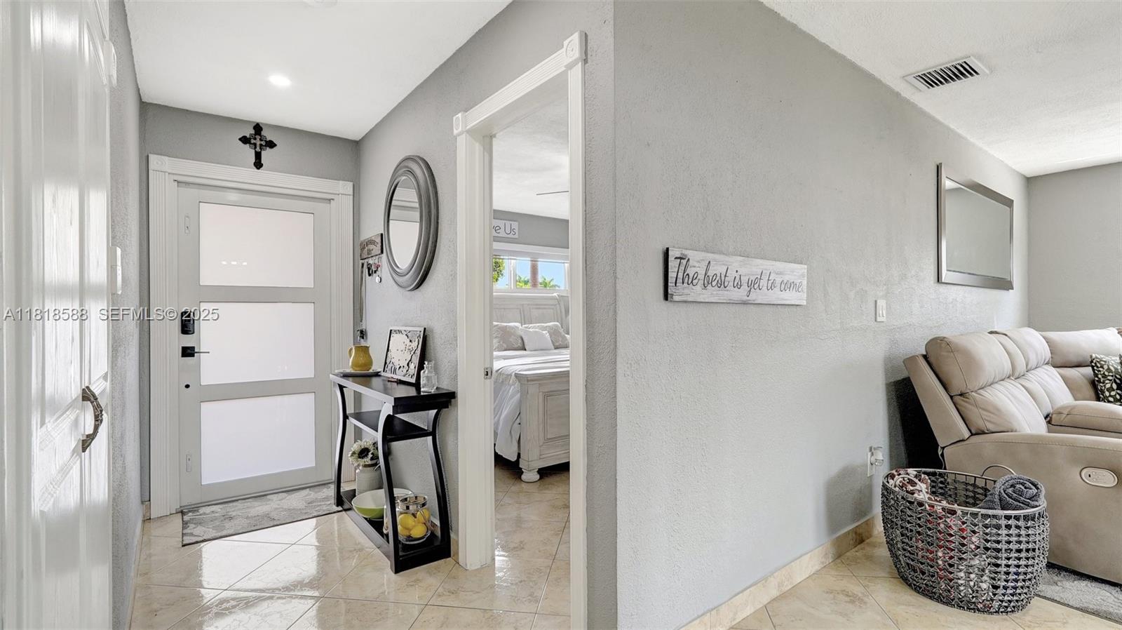 8540 Northwest 182nd Street Hialeah, FL 33015 - Photo 6 of 63 a living room with furniture and a mirror