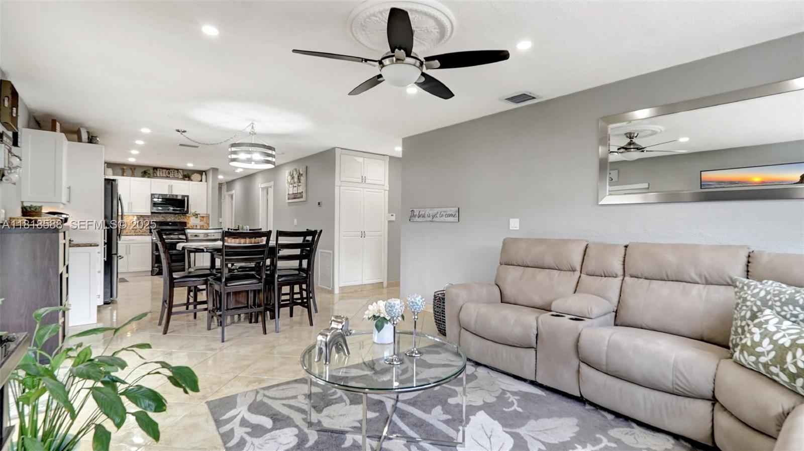 8540 Northwest 182nd Street Hialeah, FL 33015 - Photo 9 of 63 a living room with furniture and kitchen view