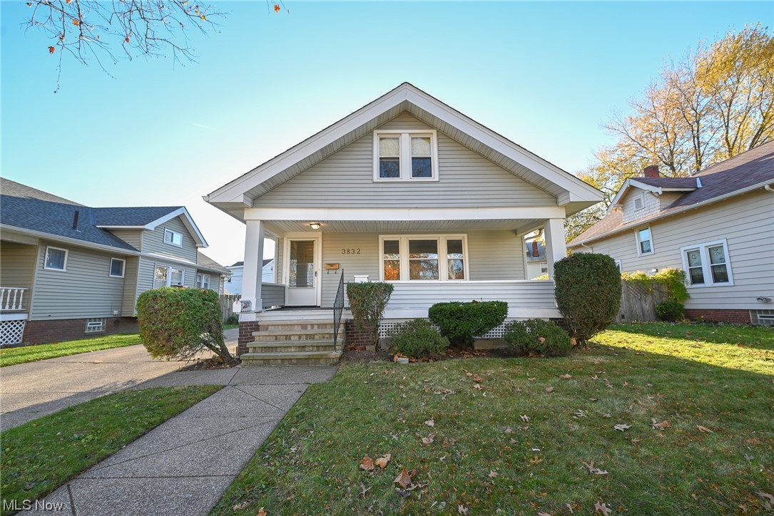 3832 Silsby Road Cleveland, OH 44111 - Photo 1 of 21 Bungalow-style house with a front yard and a porch