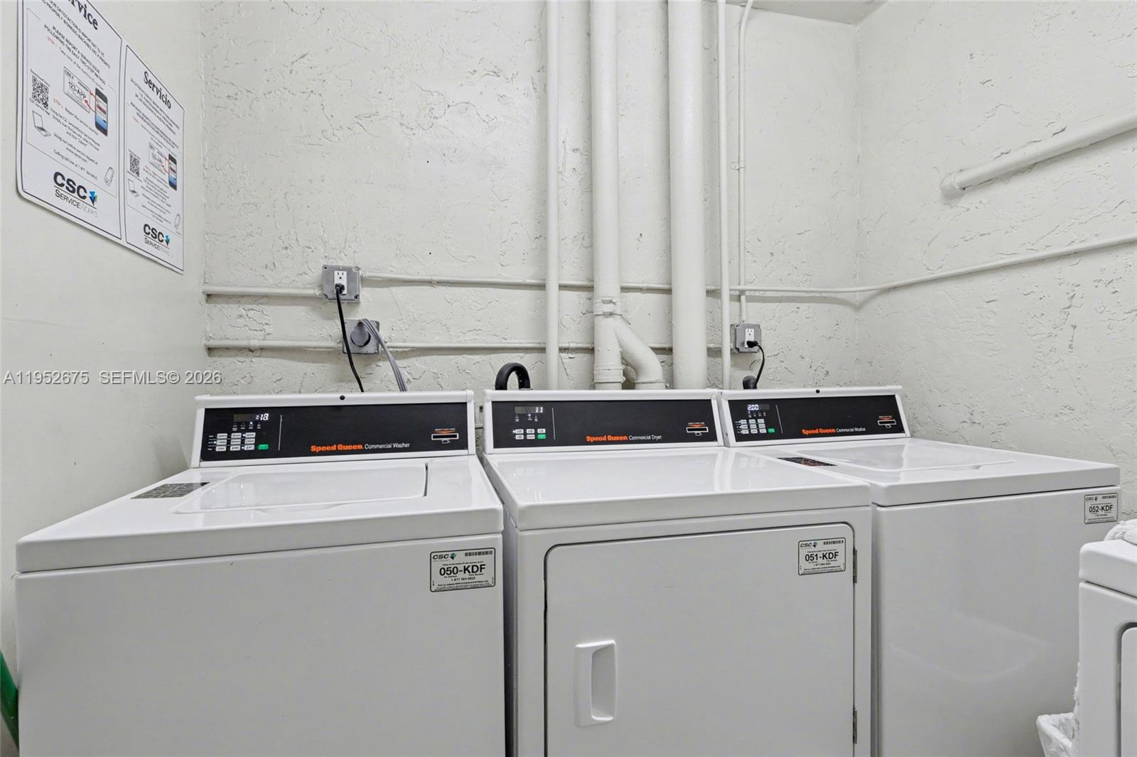 4675 West 18th Court, Unit 701 Hialeah, FL 33012 - Photo 11 of 14 a utility room with dryer and washer