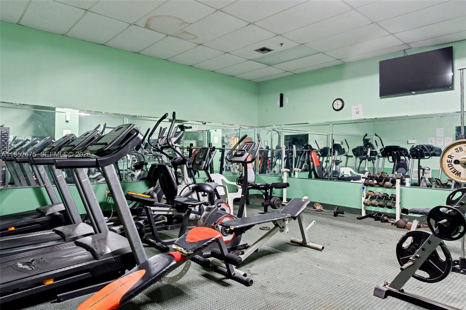 4675 West 18th Court, Unit 701 Hialeah, FL 33012 - Photo 12 of 14 a view of a room with gym equipment