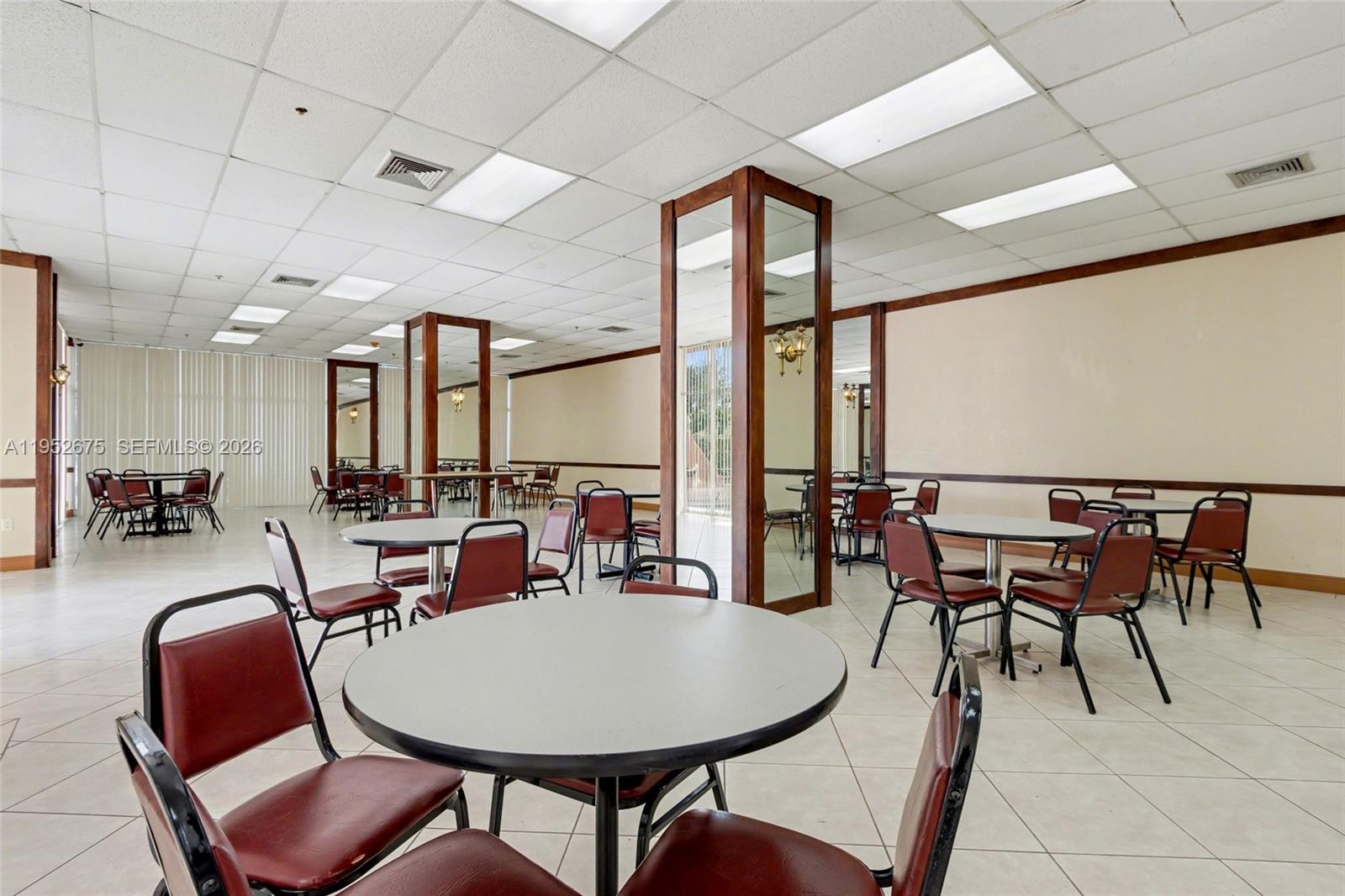 4675 West 18th Court, Unit 701 Hialeah, FL 33012 - Photo 13 of 14 a view of a dining room with furniture window and outside view
