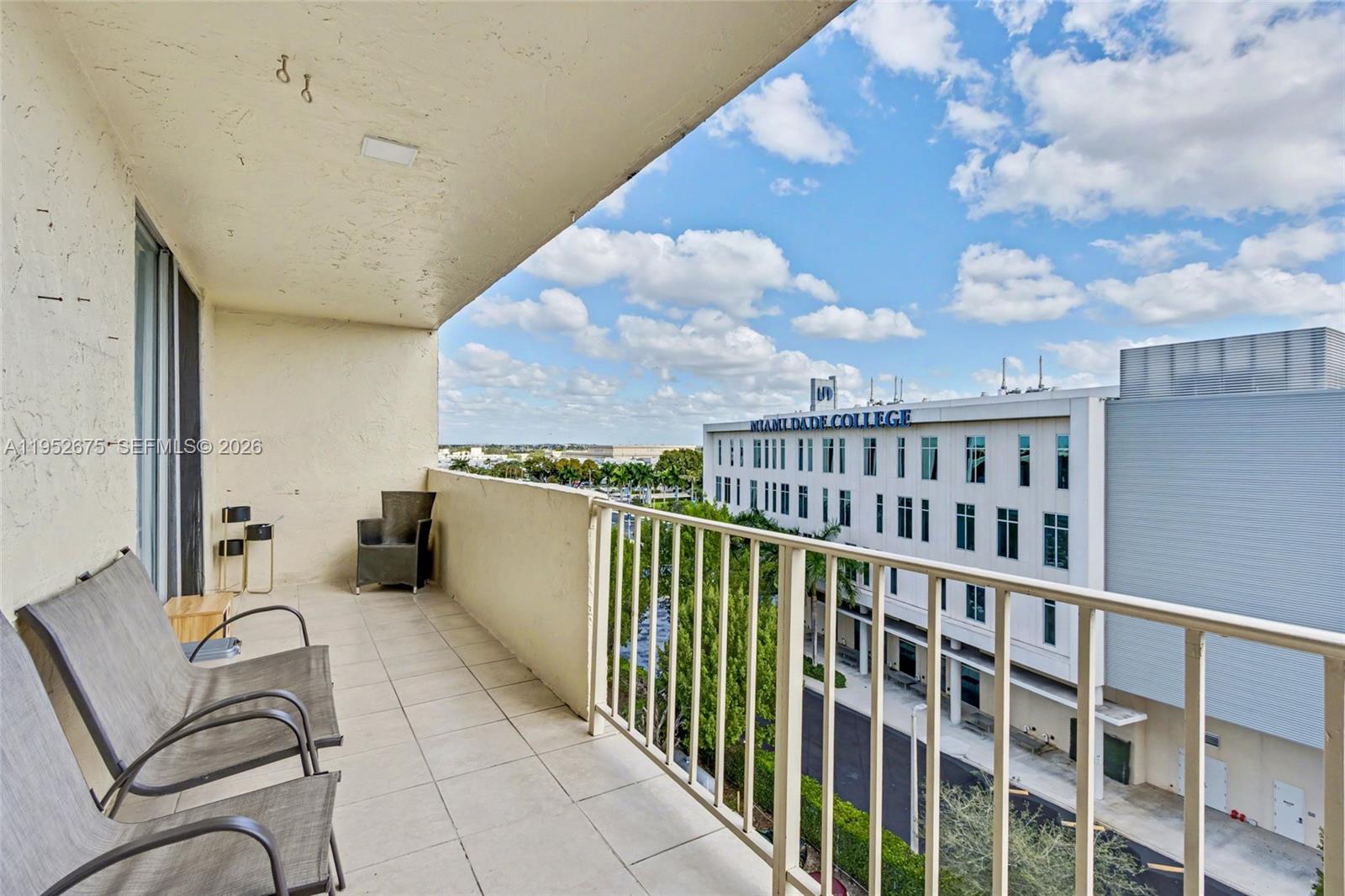 4675 West 18th Court, Unit 701 Hialeah, FL 33012 - Photo 9 of 14 a view of a balcony with furniture