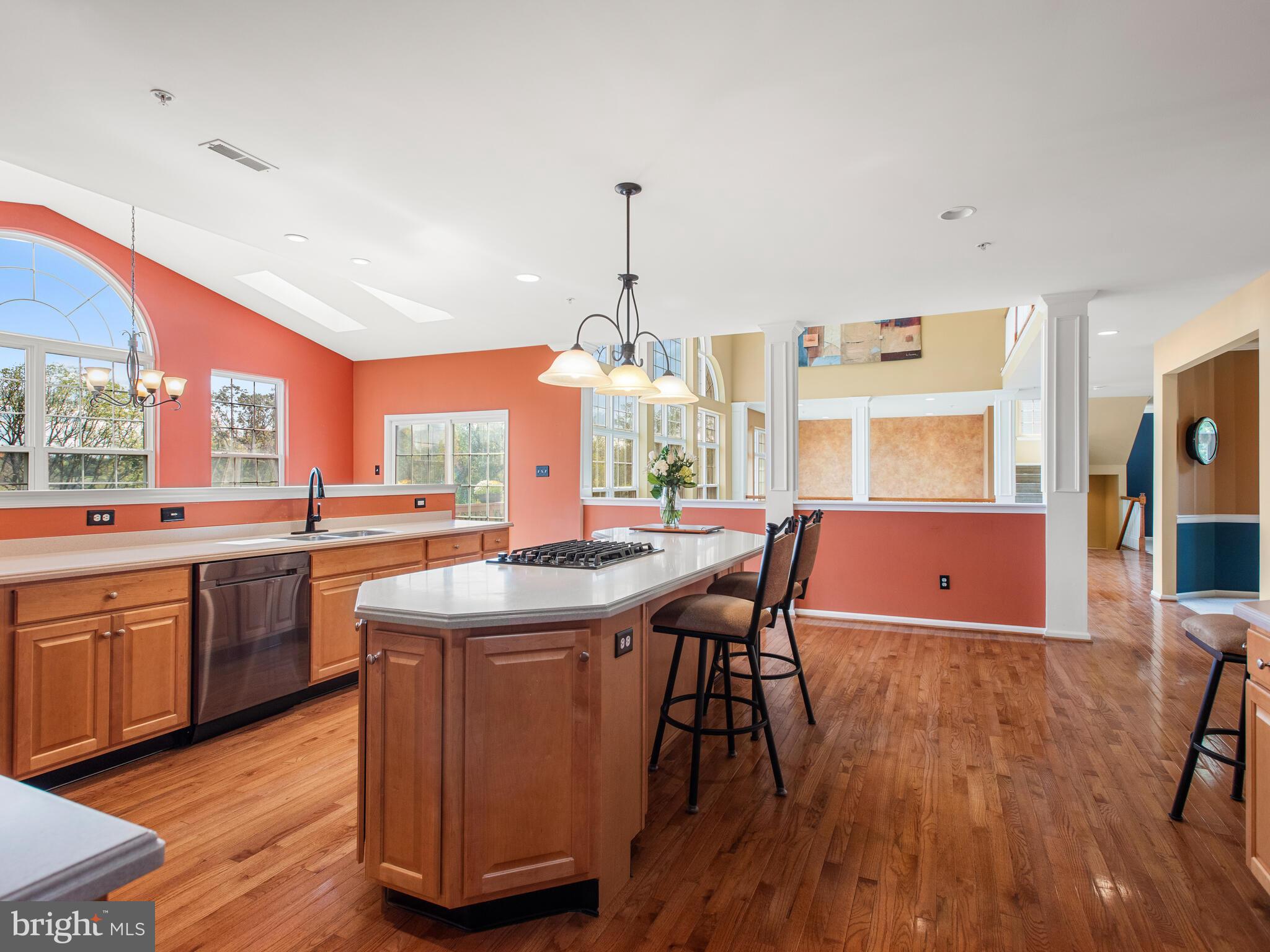 1180 Rupert Road Pottstown, PA 19464 - Photo 22 of 51 a kitchen with stainless steel appliances granite countertop wooden floors and white cabinets