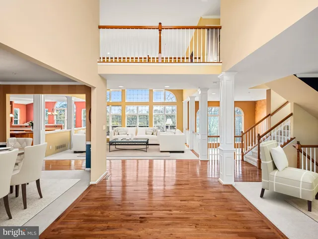 a view of an entryway with wooden floor and windows