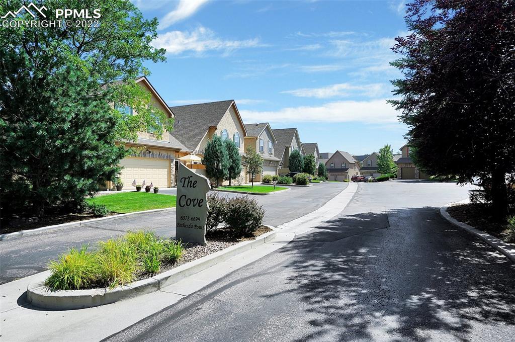 6578 Bethesda Point, Unit B Colorado Springs, CO 80918 - Photo 11 of 45 a view of a street with a houses