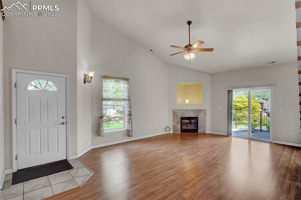 6578 Bethesda Point, Unit B Colorado Springs, CO 80918 - Photo 12 of 45 an empty room with windows and fireplace