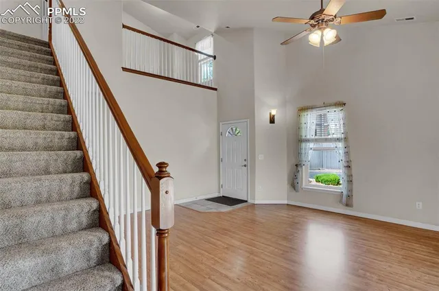 a view of an entryway with wooden floor