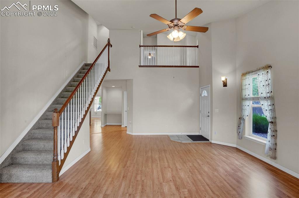 6578 Bethesda Point, Unit B Colorado Springs, CO 80918 - Photo 16 of 45 a view of an empty room with wooden floor
