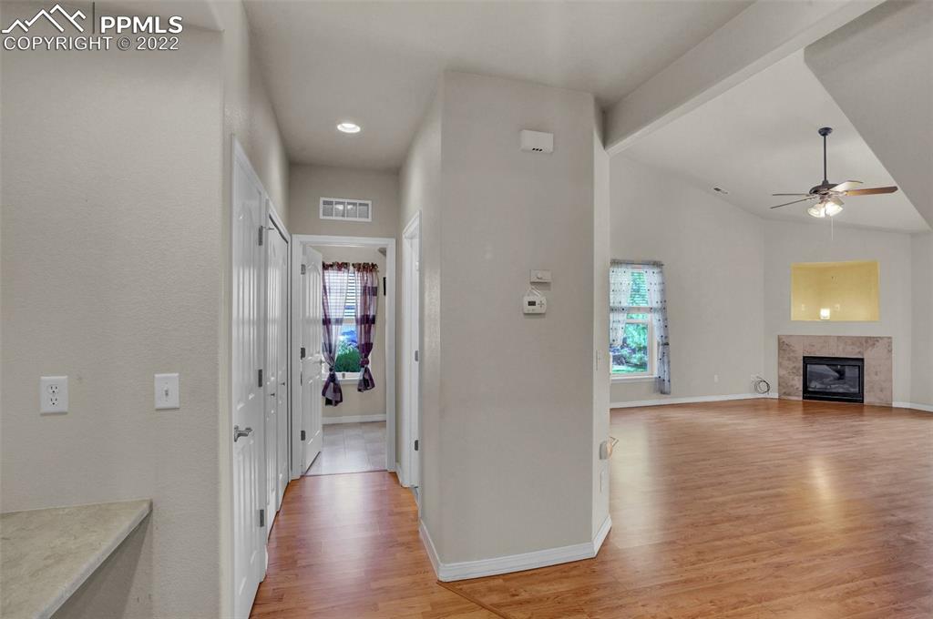 6578 Bethesda Point, Unit B Colorado Springs, CO 80918 - Photo 18 of 45 a view of a livingroom with wooden floor and furniture