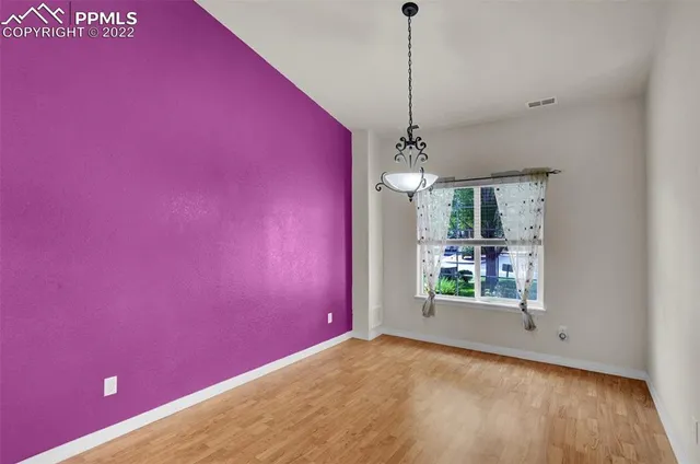 a view of a room with window and stairs