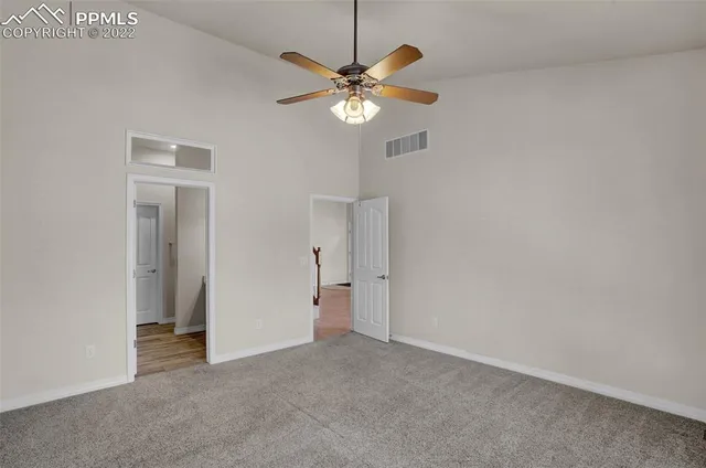a view of room with window and ceiling fan