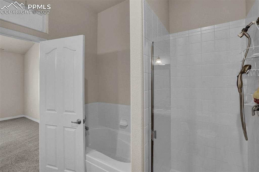 6578 Bethesda Point, Unit B Colorado Springs, CO 80918 - Photo 30 of 45 a bathroom with a bathtub