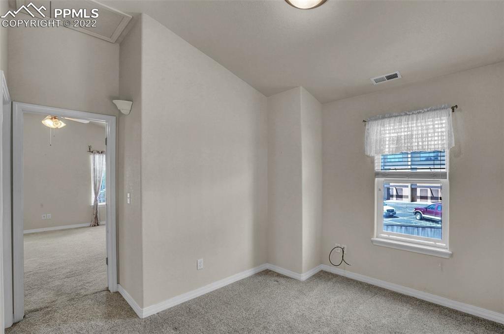 6578 Bethesda Point, Unit B Colorado Springs, CO 80918 - Photo 34 of 45 a view of an empty room with a window
