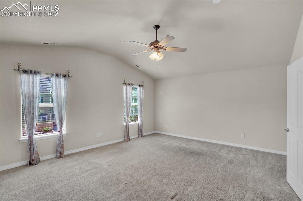 6578 Bethesda Point, Unit B Colorado Springs, CO 80918 - Photo 37 of 45 a view of an empty room with a window