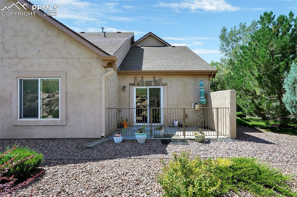 6578 Bethesda Point, Unit B Colorado Springs, CO 80918 - Photo 42 of 45 a front view of a house with garden