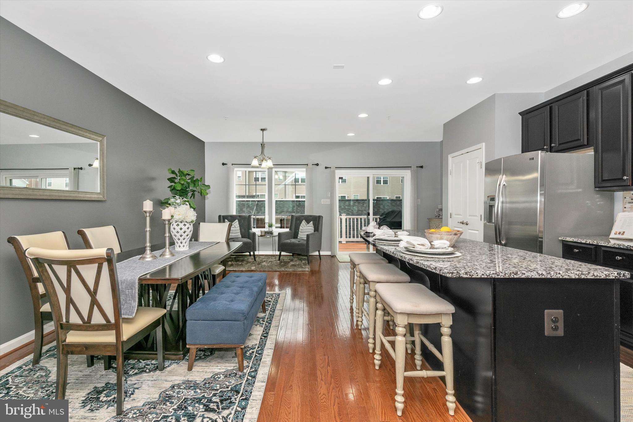 7821 Wormans Mill Road Frederick, MD 21701 - Photo 12 of 44 a dining hall with stainless steel appliances granite countertop a dining table and chairs