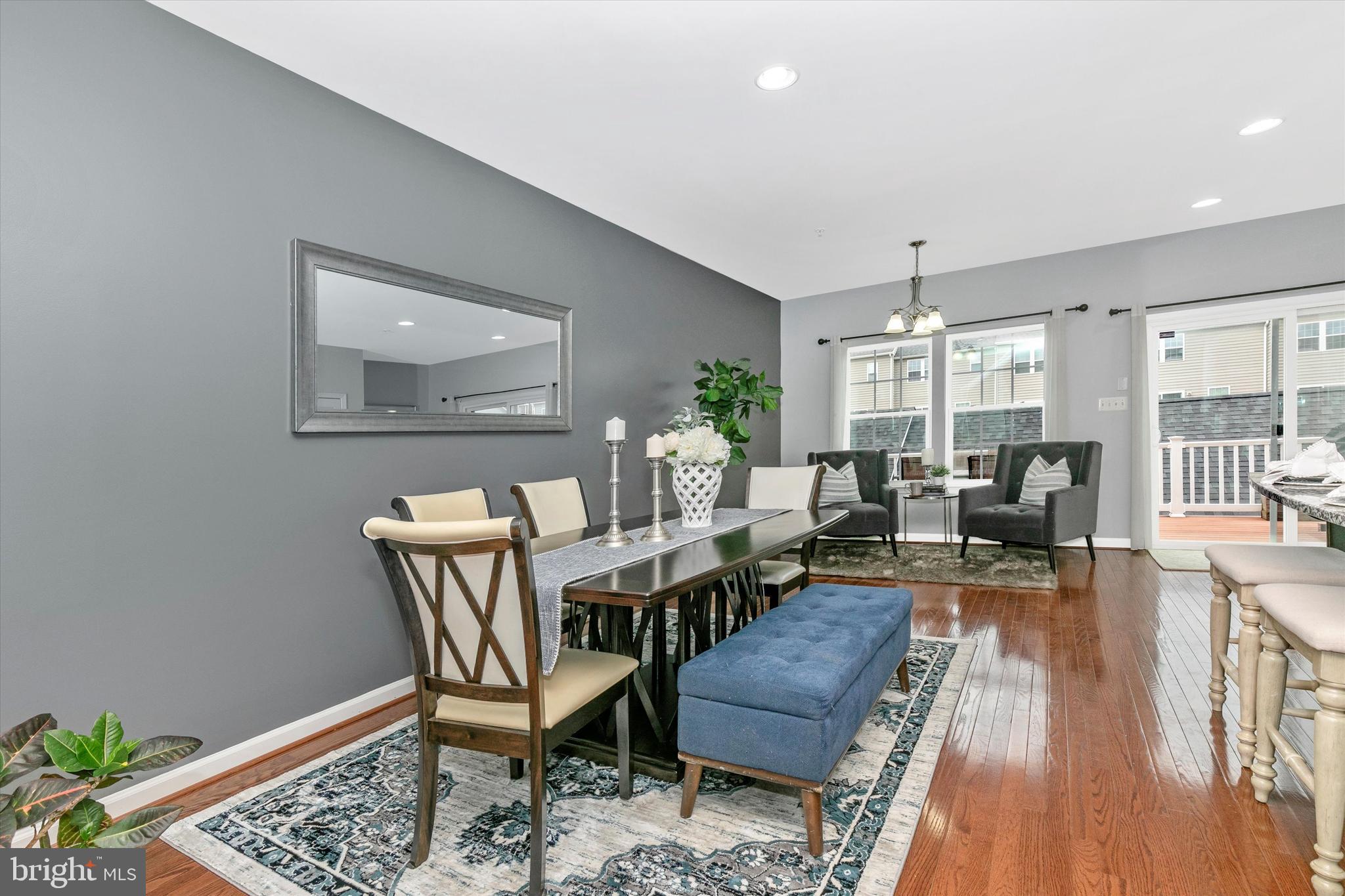 7821 Wormans Mill Road Frederick, MD 21701 - Photo 15 of 44 a view of a dining room with furniture window and wooden floor