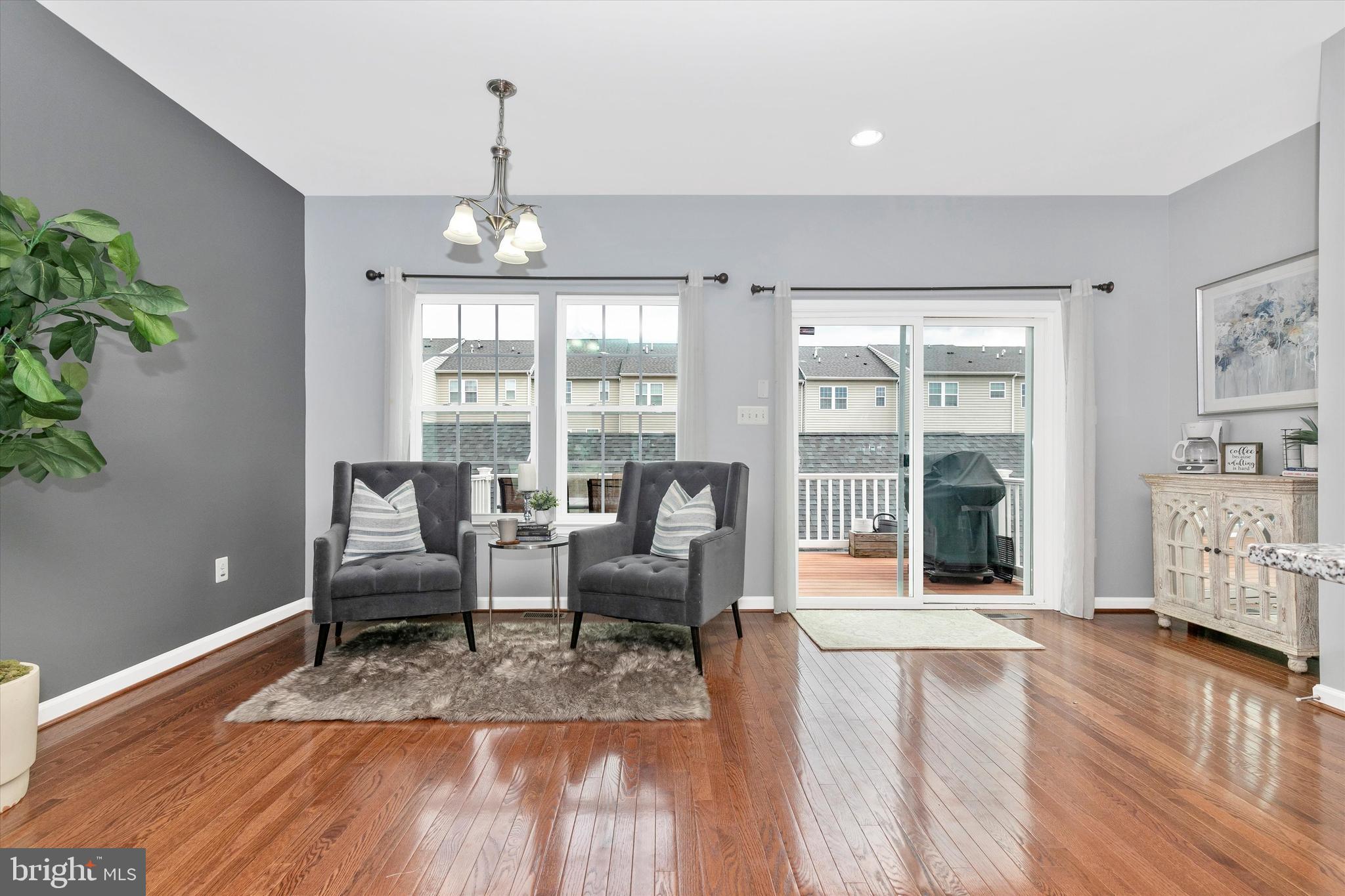 7821 Wormans Mill Road Frederick, MD 21701 - Photo 16 of 44 a living room with furniture large window and wooden floor
