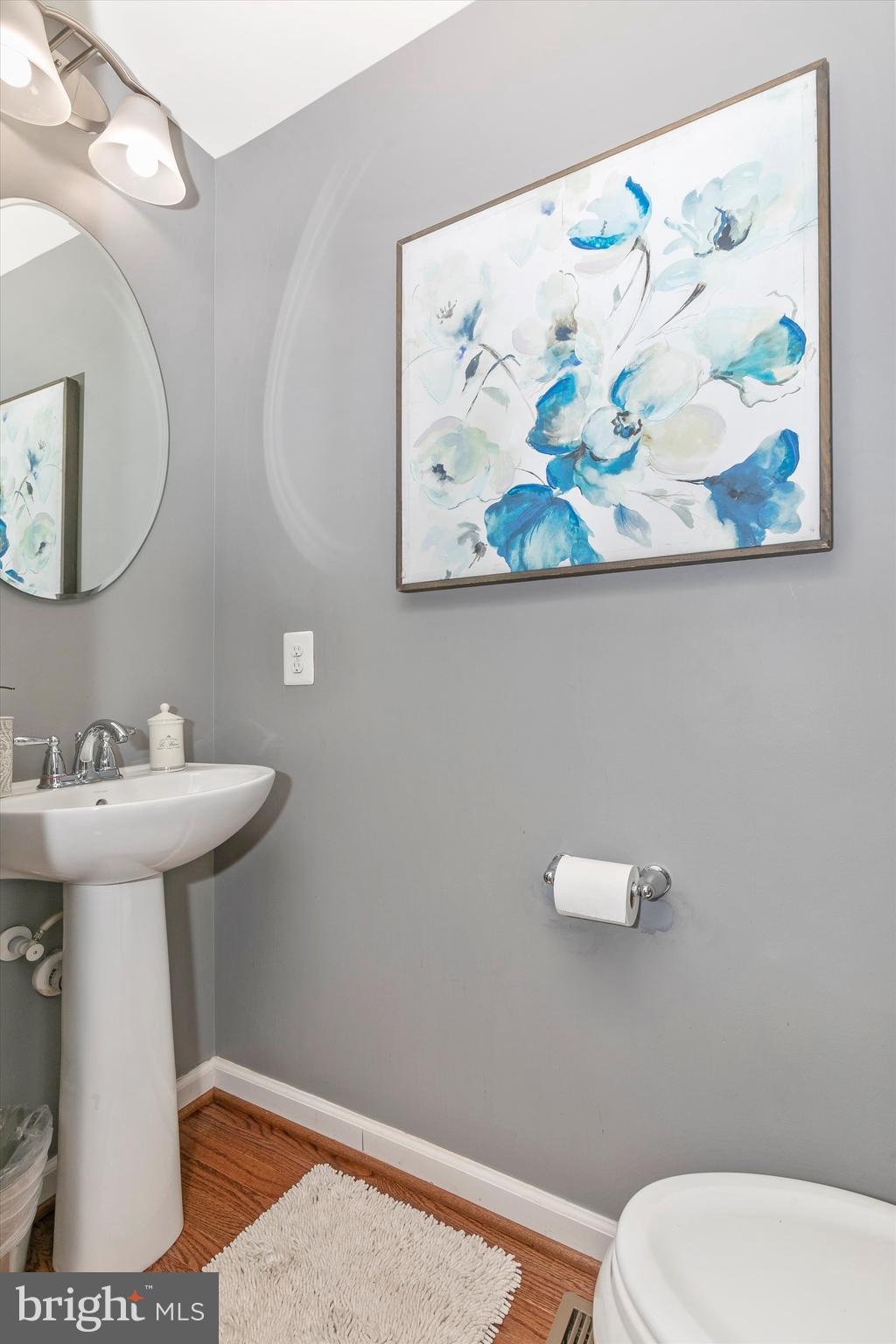 7821 Wormans Mill Road Frederick, MD 21701 - Photo 22 of 44 a bathroom with a toilet a sink and mirror