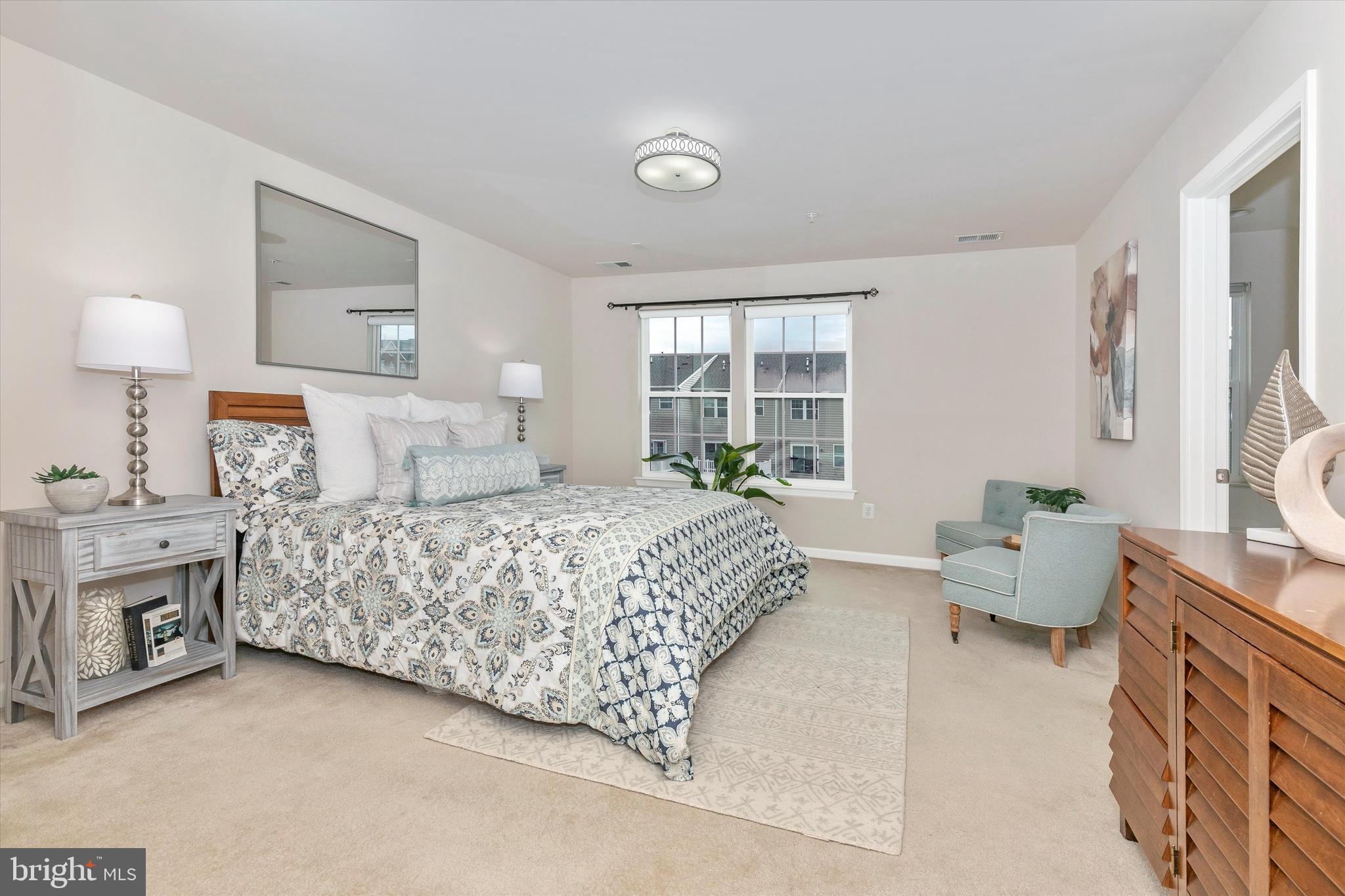 7821 Wormans Mill Road Frederick, MD 21701 - Photo 25 of 44 a bedroom with a bed and a couch