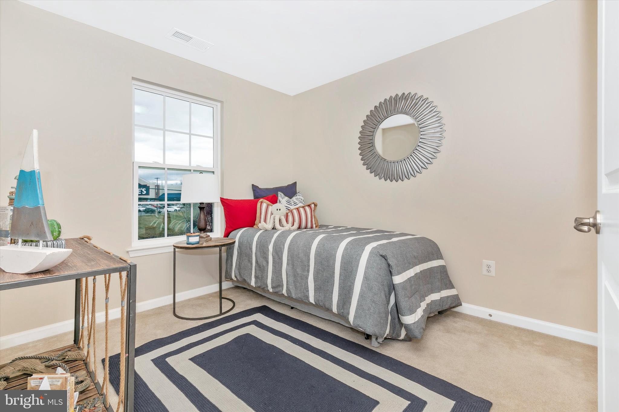 7821 Wormans Mill Road Frederick, MD 21701 - Photo 29 of 44 a bedroom with a bed and a table in it