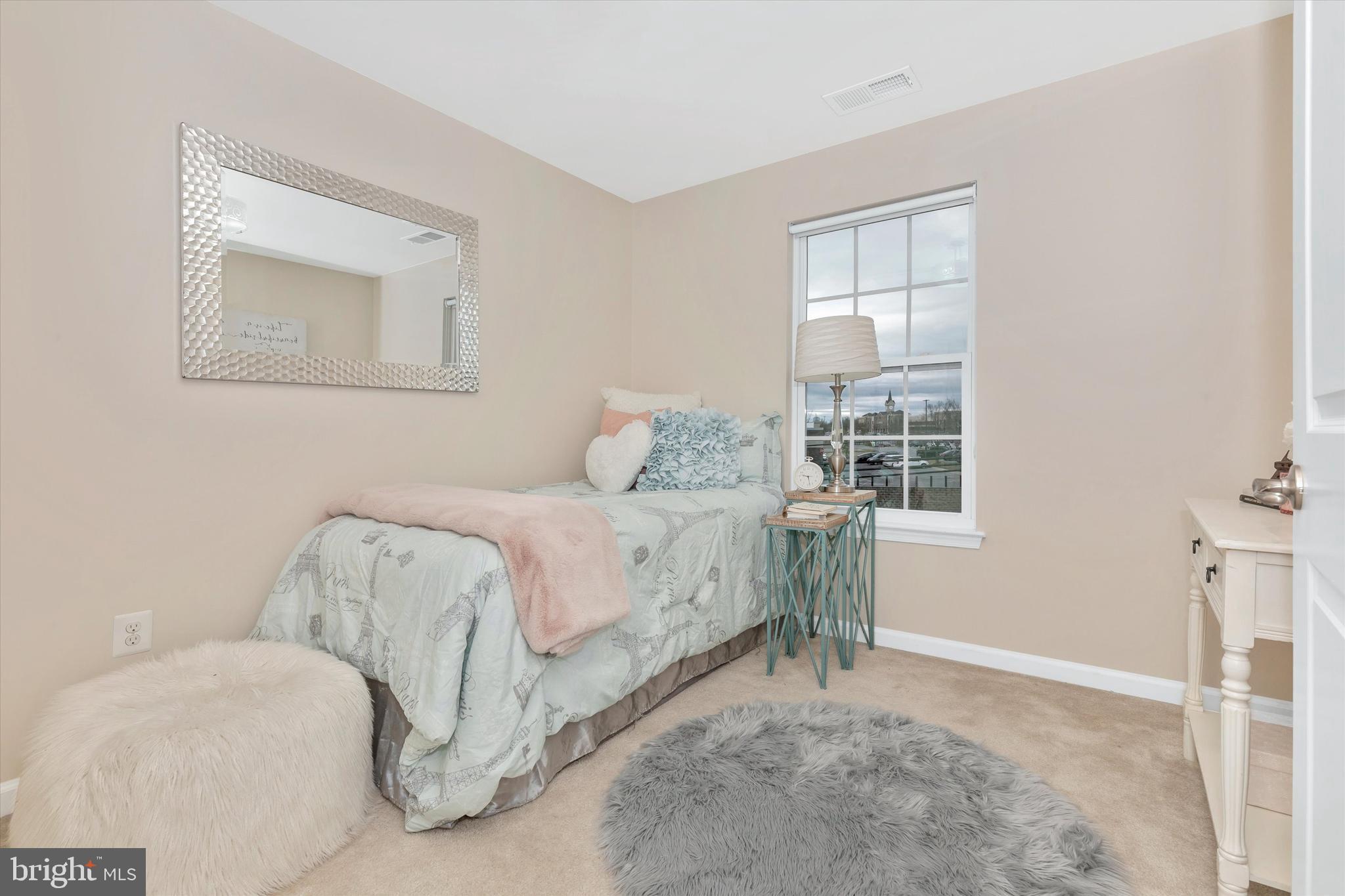7821 Wormans Mill Road Frederick, MD 21701 - Photo 30 of 44 a bedroom with a bed and a window
