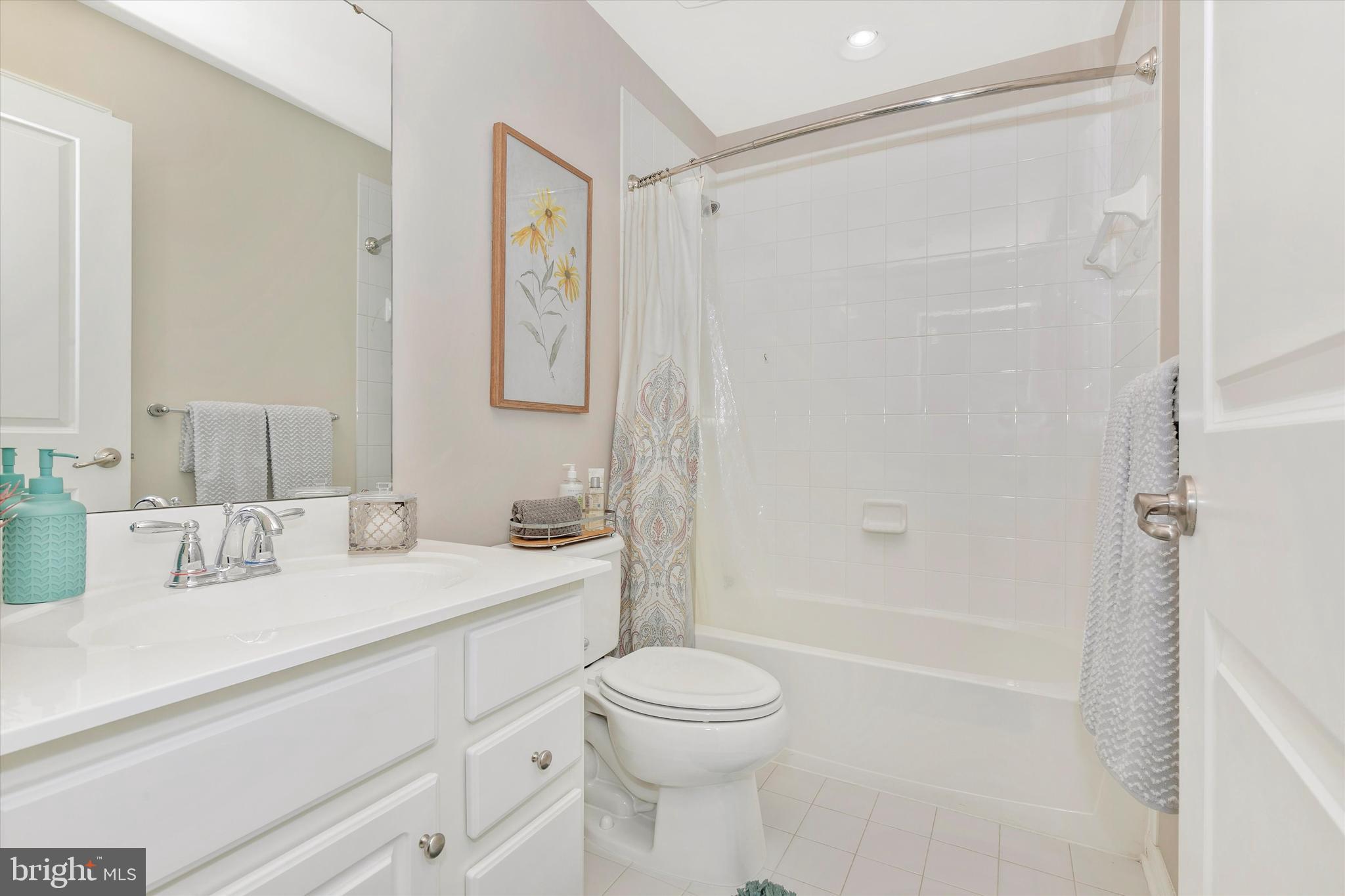 7821 Wormans Mill Road Frederick, MD 21701 - Photo 32 of 44 a bathroom with a sink a toilet and shower