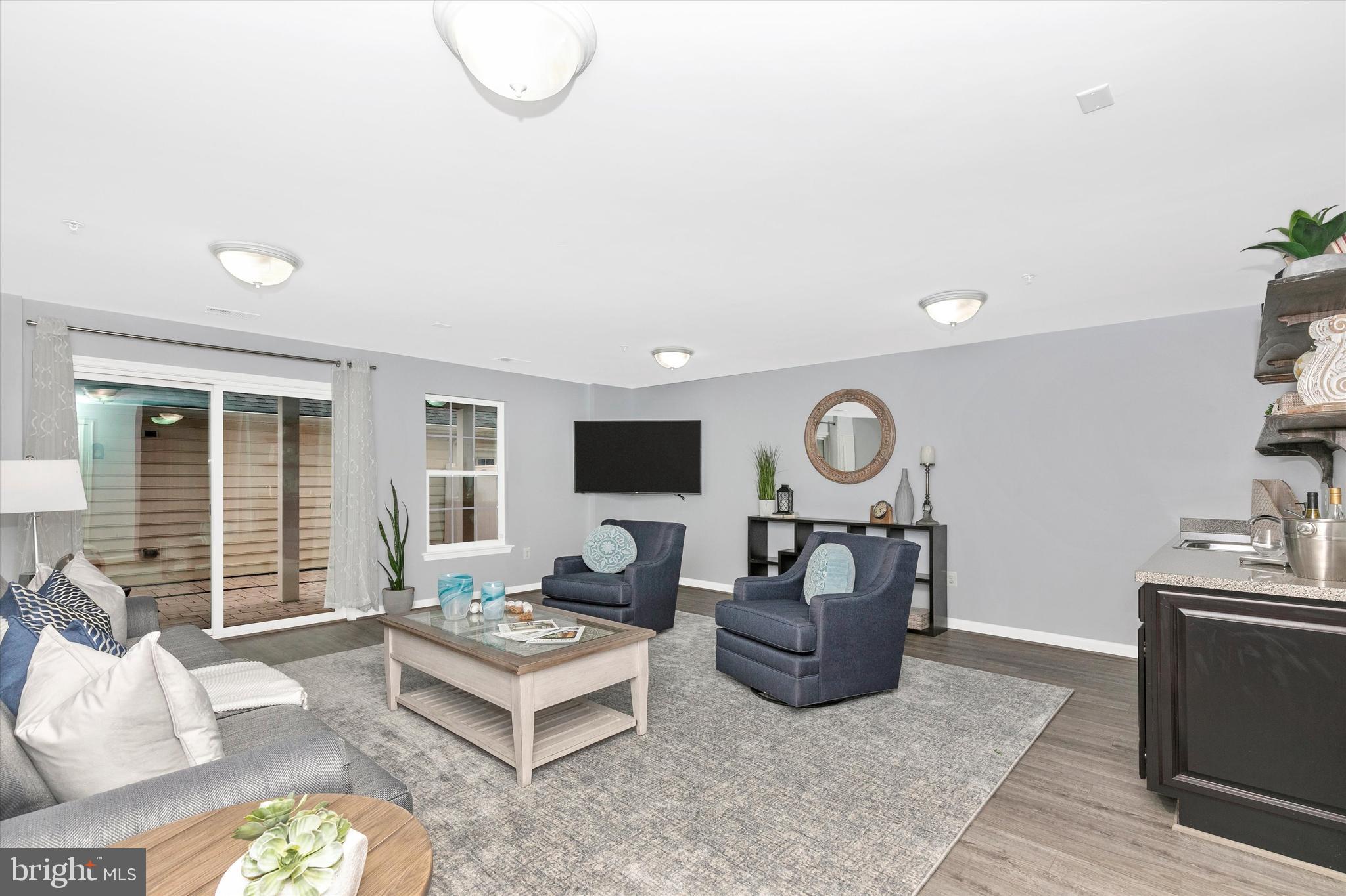 7821 Wormans Mill Road Frederick, MD 21701 - Photo 5 of 44 a living room with furniture window and a fireplace
